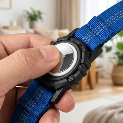 Hand placing an Apple AirTag into the holder case on the Joobello dog collar to show how it works