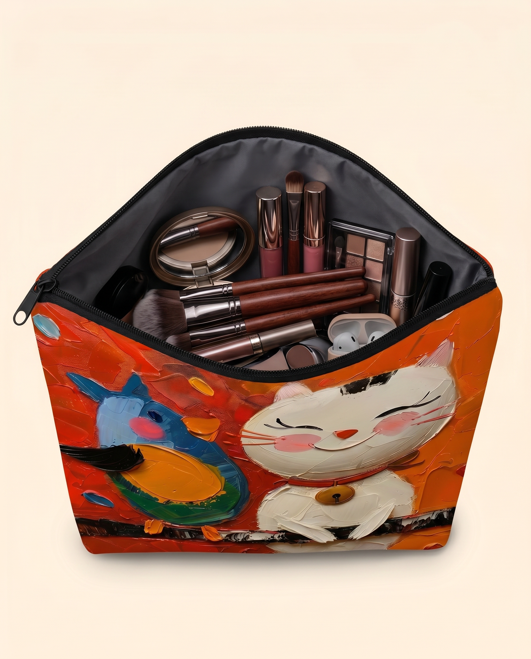 Joobello cat-print makeup bag open and filled with makeup brushes and cosmetics showing roomy capacity
