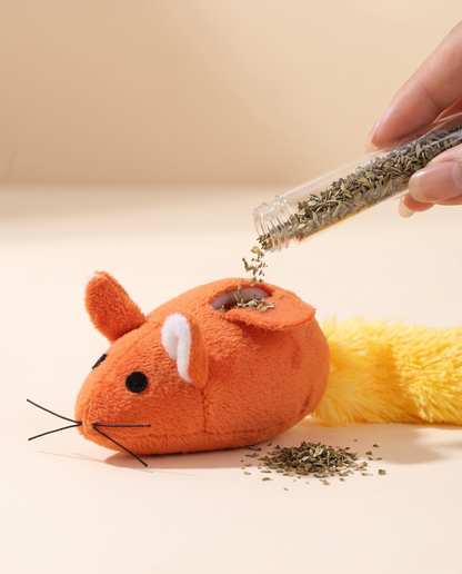 Refilling catnip into the Joobello plush mouse toy from its refillable catnip tube