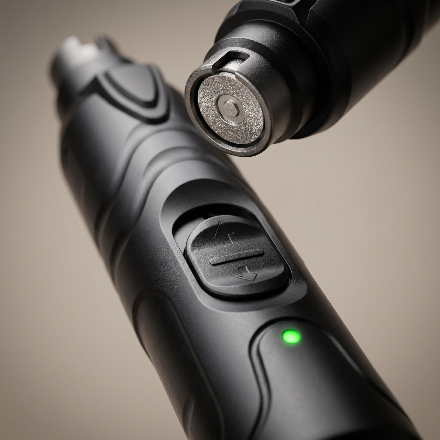 Close-up of the Joobello LED nail grinder diamond grinding wheel, speed button and green power light