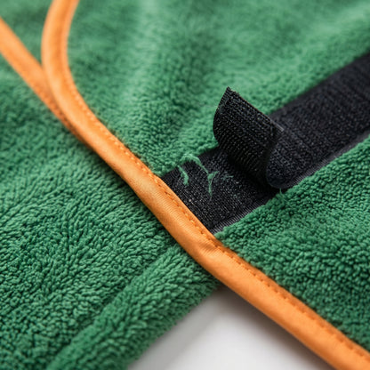 Close-up of the Joobello green microfiber bath robe towel texture, orange trim and velcro